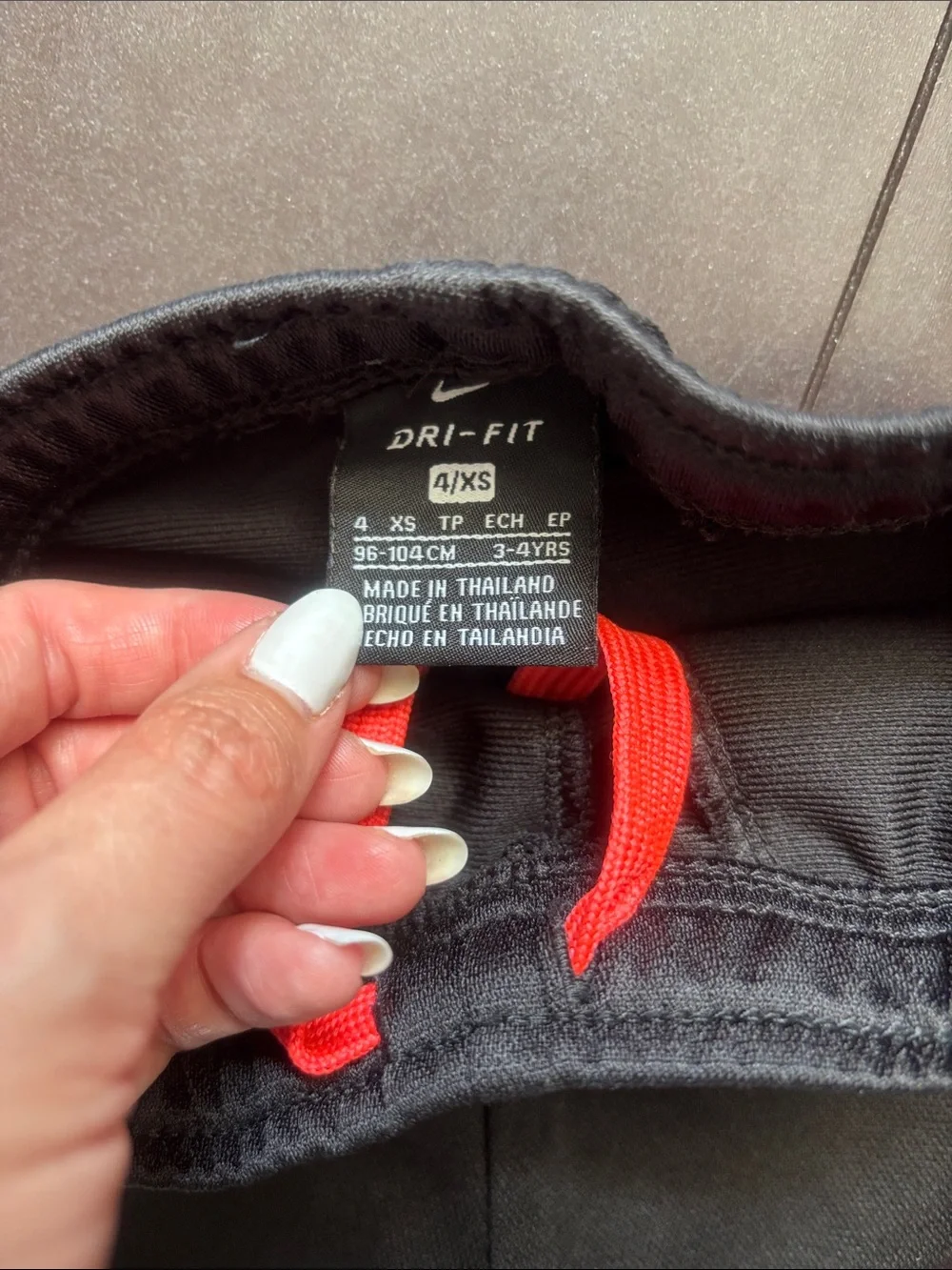 Nike Black Joggers with Red Side Stripes - Kids